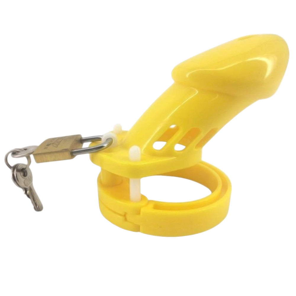 Vibrant yellow penis cage sissy for work and play, offering size adaptability with five rings. A playful alternative; great for bosses seeking discreet control shots!