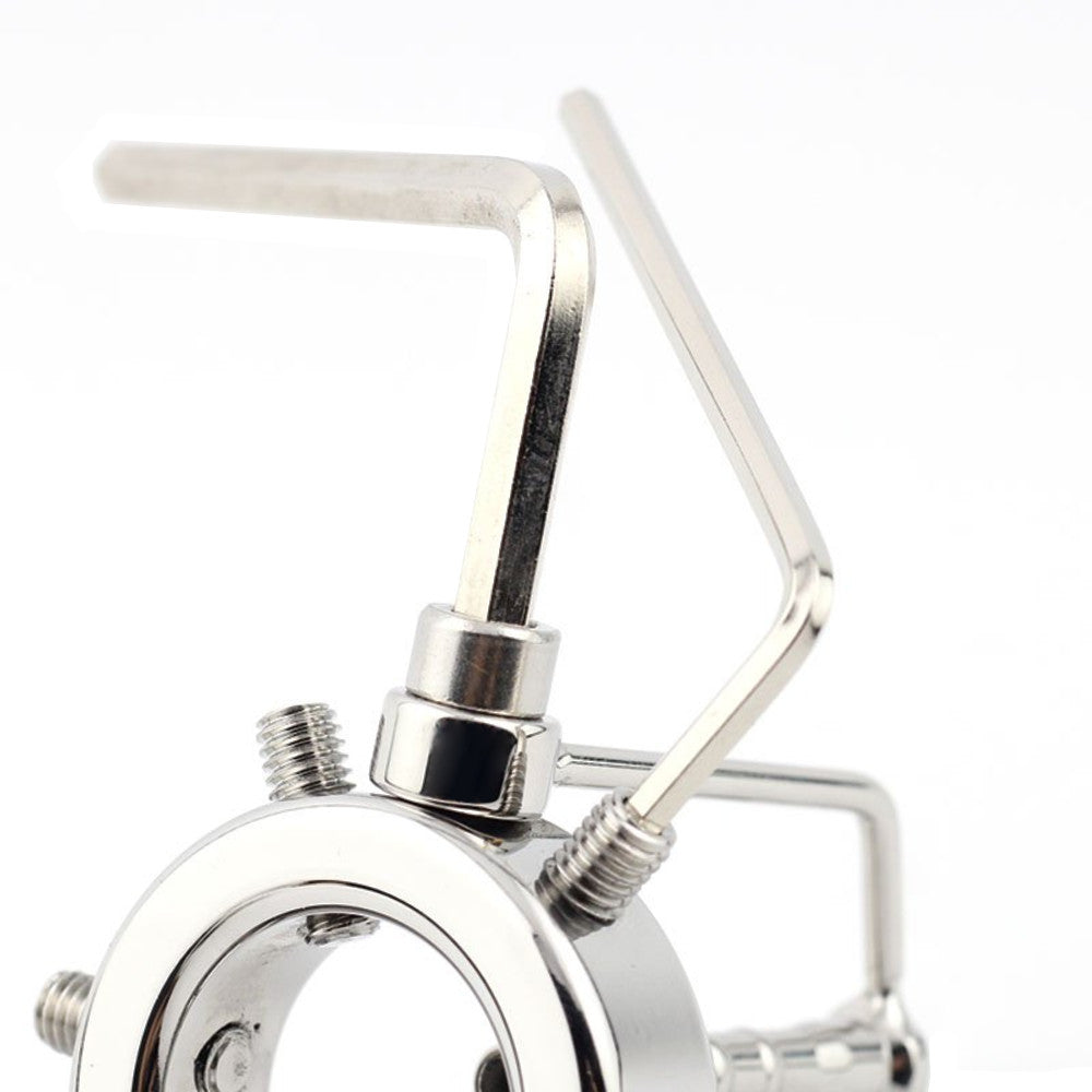 Crafted from welded steel, this device features adjustable screws and a plug penis insert for urethra play. Shaped like a PVC pipe, use the key to adjust the perfect fit.