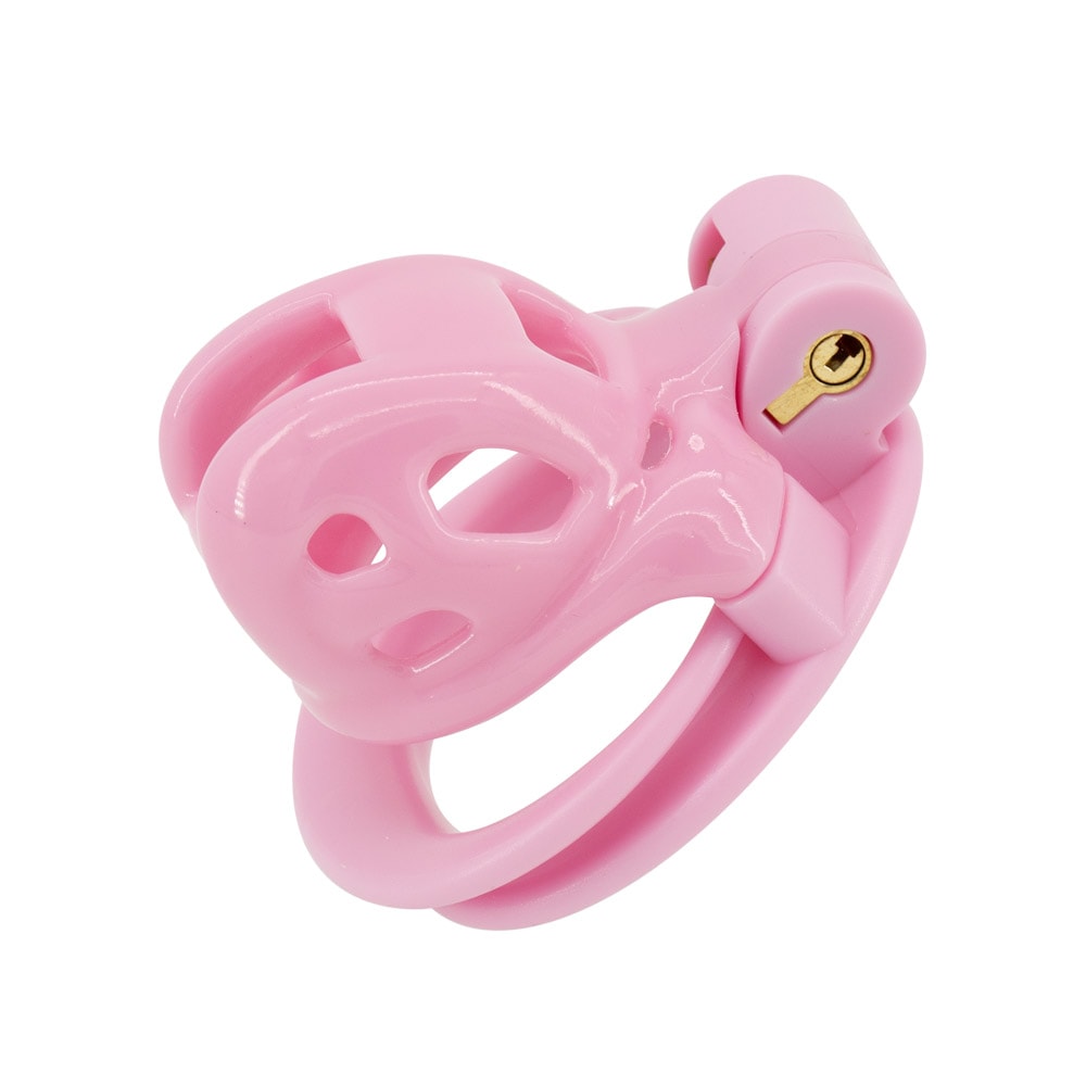 Embrace your submissive fantasies with this pink cock cage, offering secure comfort and style. Perfect under an athletic thong or bikini, its breathable design allows for long-term wear. Find your perfect fit today.