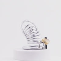 Embrace control and heightened sensations with this spiral-designed steel cage. Keeping his sensitive parts securely enclosed, the cool touch of metal leaves him aroused yet restrained. Wearable even while peeing, it won't hurt but ensures he stays obedient.