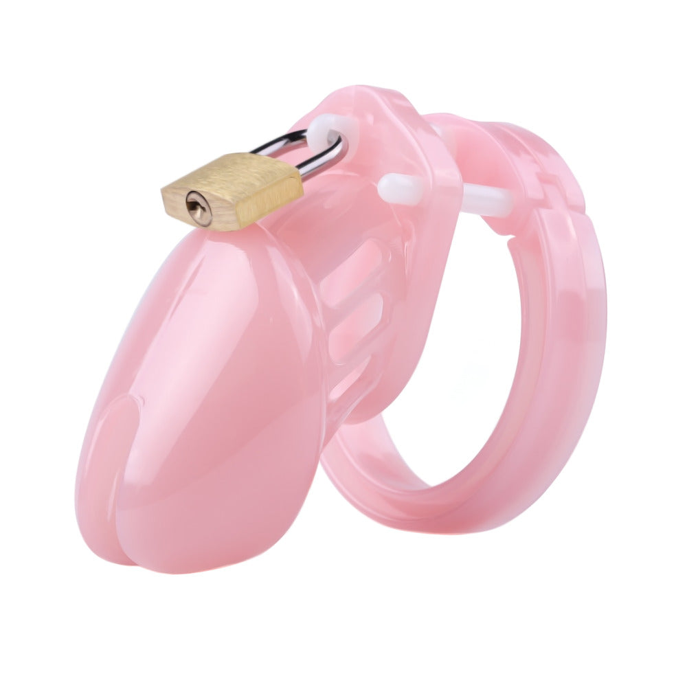 Enhance your roleplay and crossdressing adventures with this small male chastity device. The mini chastity cage adds a thrilling touch of humiliation, perfect for pegging sessions, keeping your manhood securely locked while embracing your feminine side.