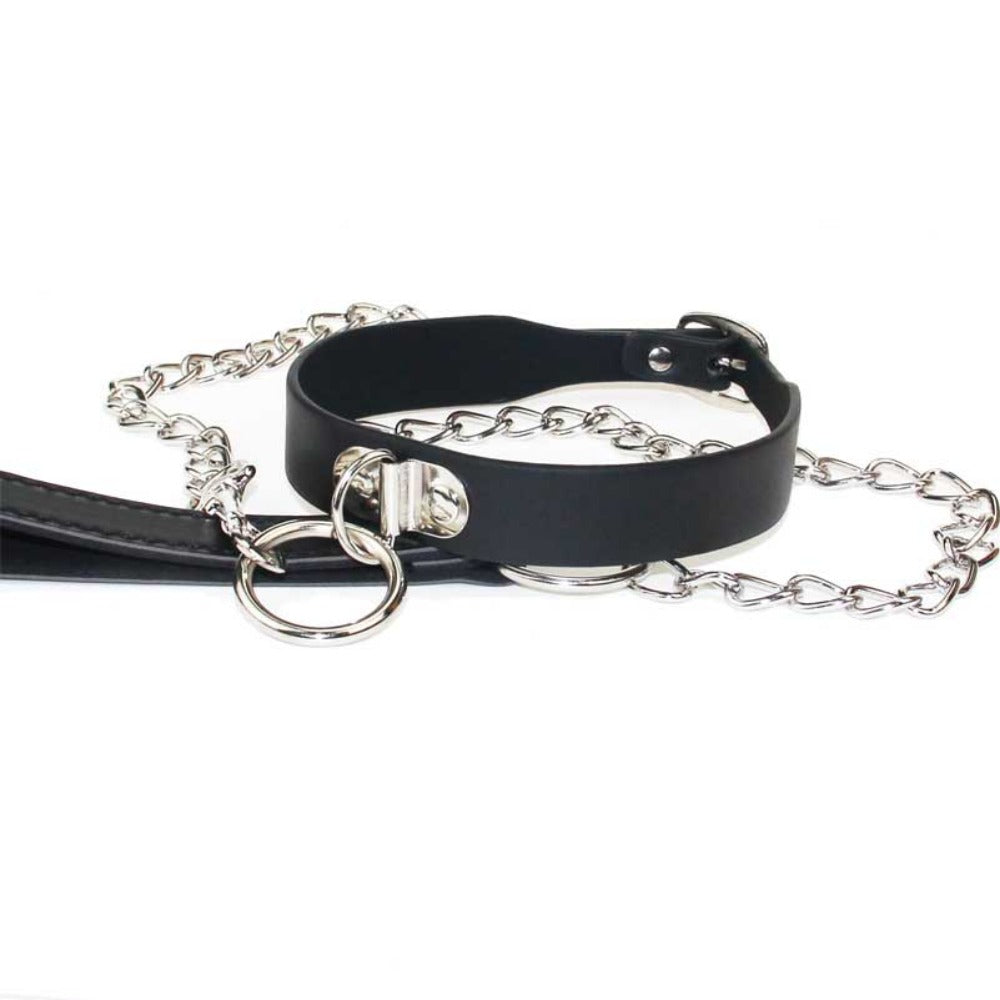 This black collar combines durable synthetic leather and stainless steel for a captivating look that pops discreetly under clothing. Perfect for BDSM play, its comfortable and stylish without drawing undue attention, creating a strong link between partners.