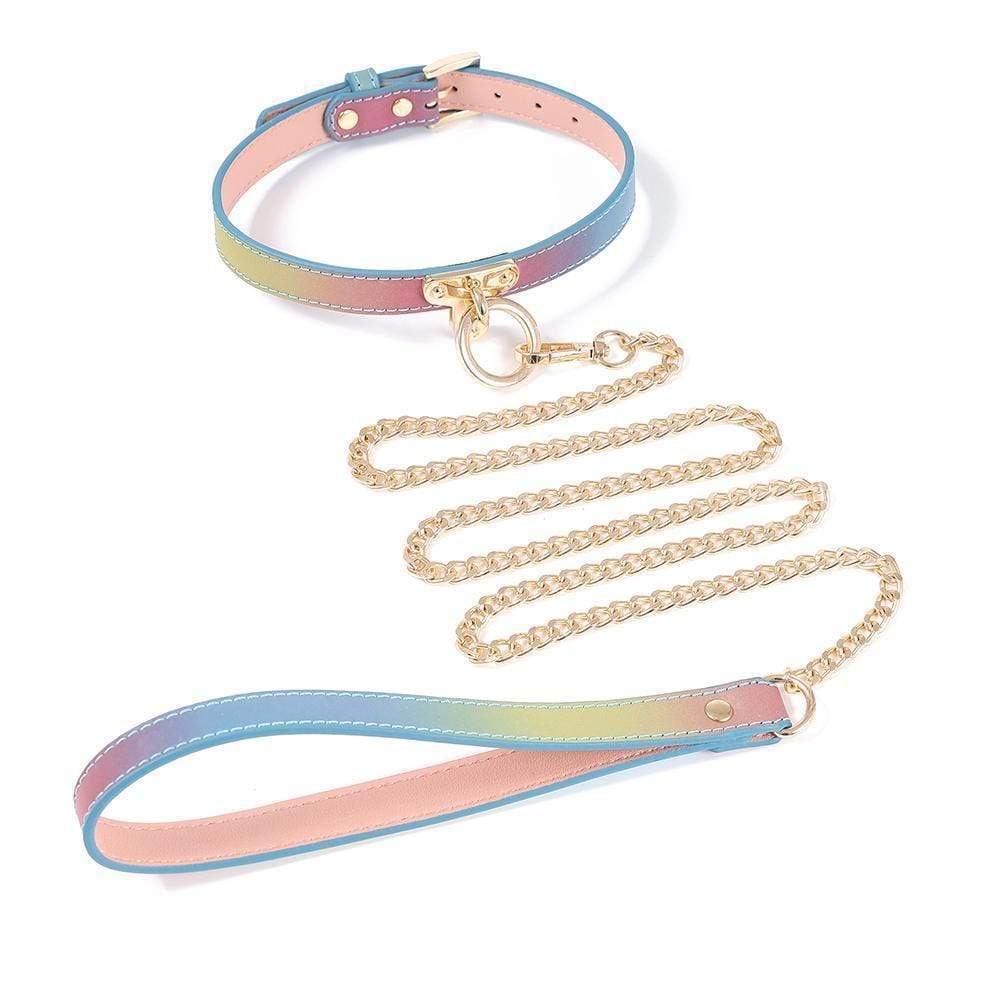 Elevate your bondage play with these golden accessories: a rainbow vegan leather collar featuring gold buckles and chain. This lite restraint offers style and comfort for a classy touch in your sensual adventures.