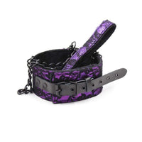 Elevate your dominant side with the Mistress Chastity Purple Collar With Leash. Crafted from high-grade synthetic leather, it's perfect for both alpha and sub roles, enhancing submission and transforming your intimate moments.